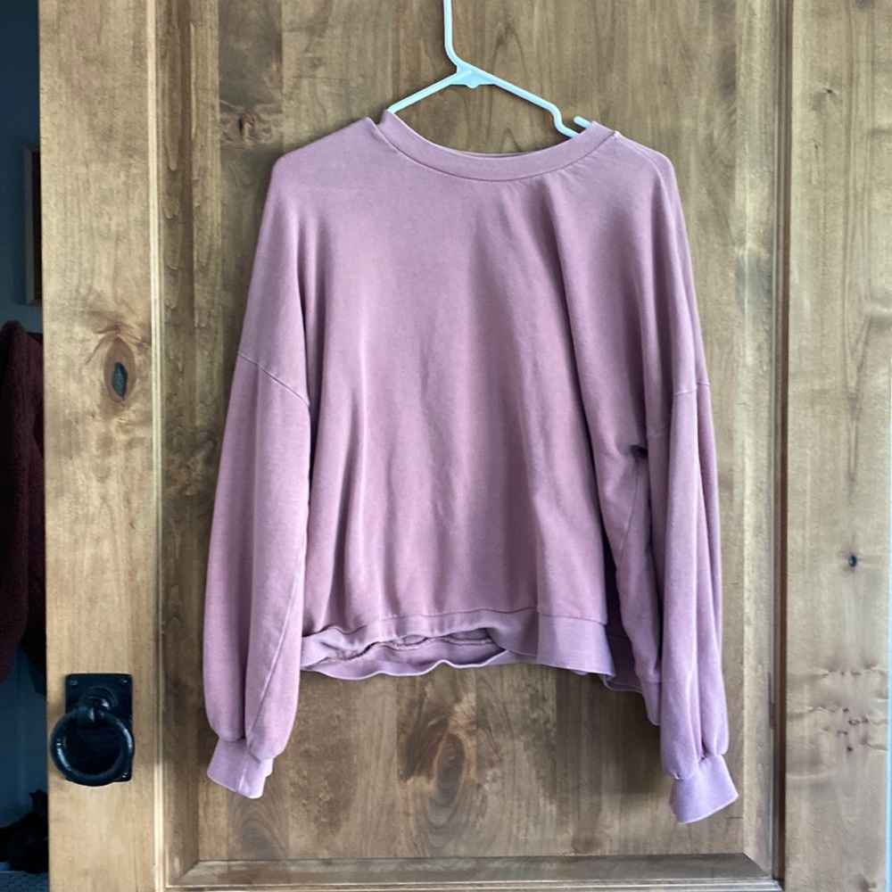 a pink sweatshirt